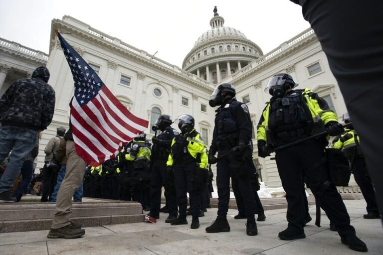 Two Capitol Police officers suspended and at least 10 more under investigation for alleged roles in riot