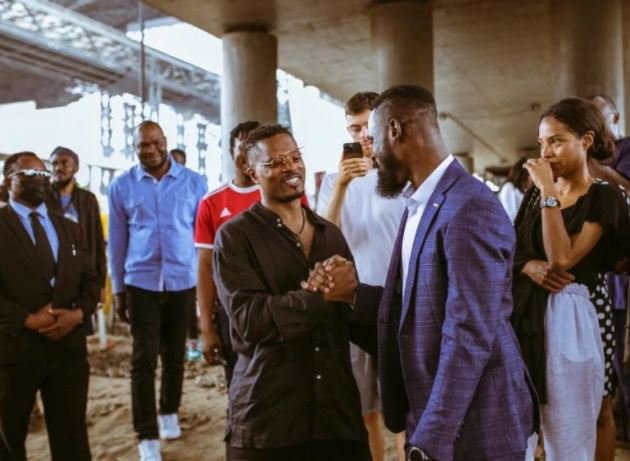 Man United legend Patrice Evra visits Oshodi under bridge, plays chess with children