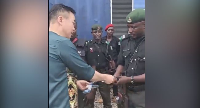 Police To Sanction Officers Seen Receiving Money From Chinese Nationals