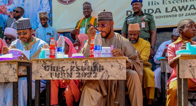 Gov Lawal Launches School Feeding Programme, Shares Meal With Zamfara Pupils