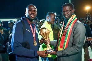 Senegal Team Returns Home, Presents AFCON Trophy To President